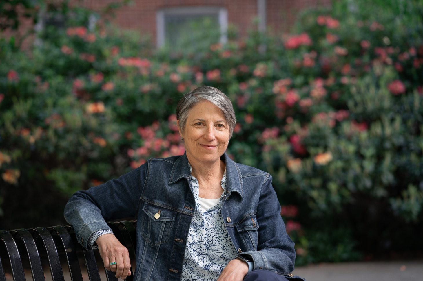 Andrea Marks sitting on a bench outside of Austin Hall